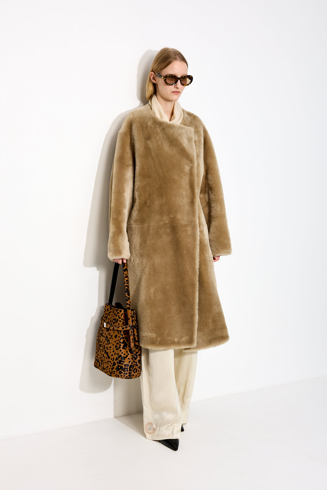 Collarless shearling coat