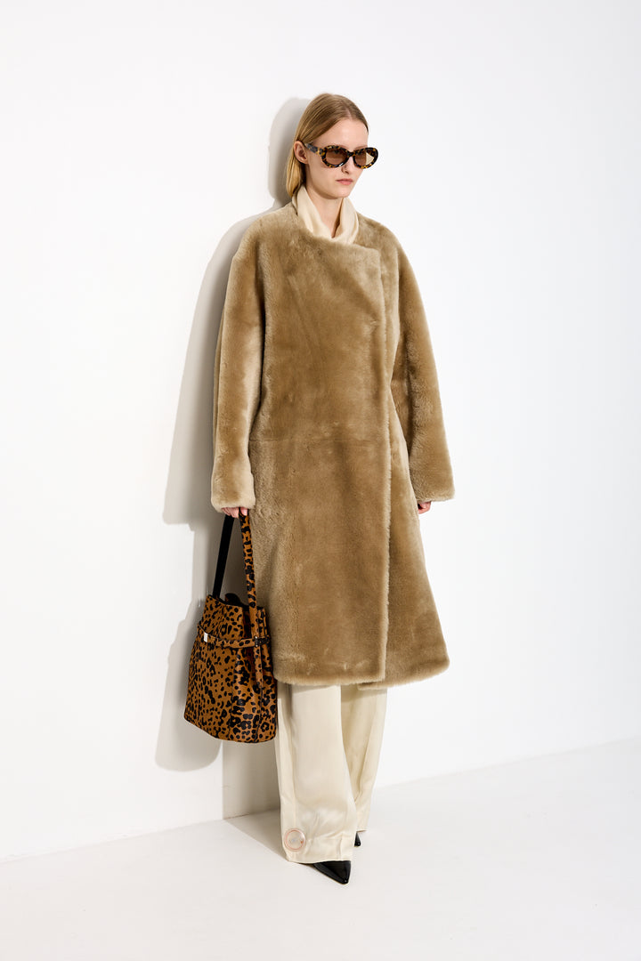 Collarless shearling coat