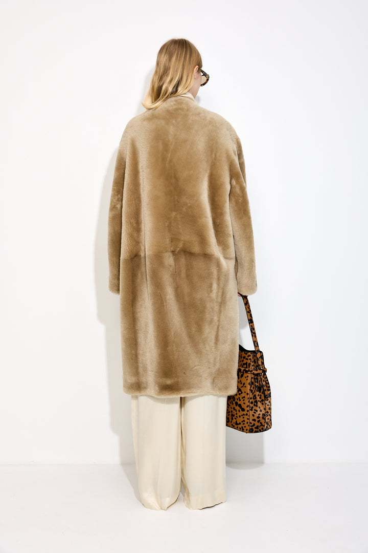 Collarless shearling coat